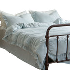Washed linen bedding set with fringe trim and natural texture
