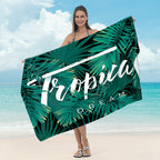 Beach towel with tropical leaf design Kalsten