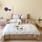 Children's bedding set made of fine cotton blend with pastel-colored polka dot print and teddy appliqué