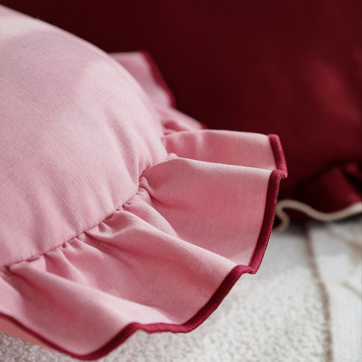 Heart-shaped decorative pillow with ruffled trim and embroidered inscription Kalsten