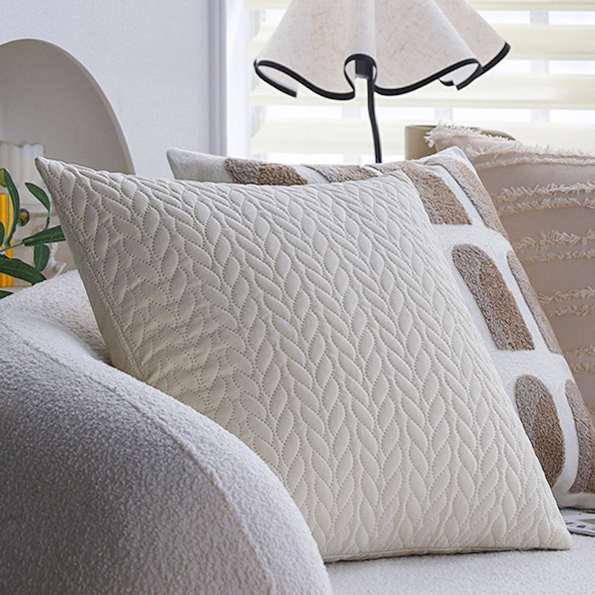 Square decorative pillow cover with tufted grid relief and tassel appliqués Kalsten