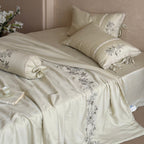 Elegant bedding set made of cotton satin with floral embroidered border and decorative roll cushion Kalsten