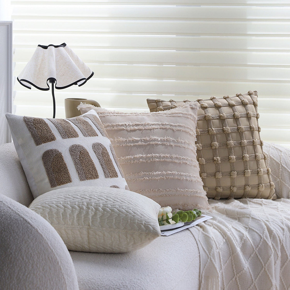 Square decorative pillow cover with tufted grid relief and tassel appliqués Kalsten
