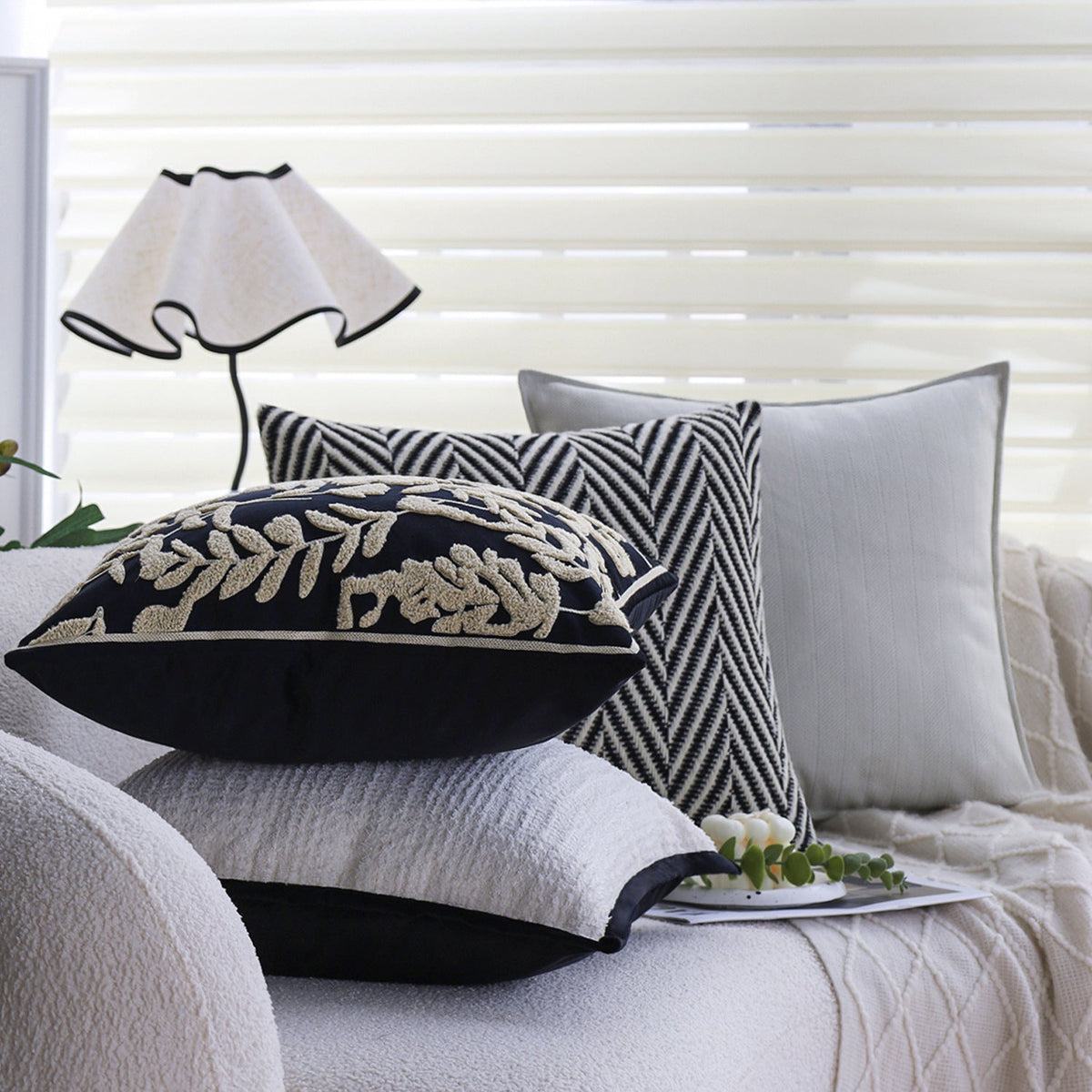 Square cushion cover with subtle herringbone texture and surrounding piping seam Kalsten