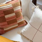 Decorative cushion made of linen look with hand-tied fringes and cross-stitch detail