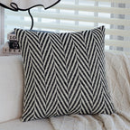 Square cushion cover with subtle herringbone texture and surrounding piping seam Kalsten