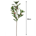 Artificial branch with decorative fruits