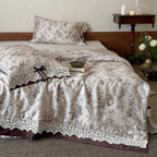 Satin bed linen set with romantic floral pattern and lace border Kalsten