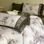 Satin bed linen set with floral print and delicate lace trim