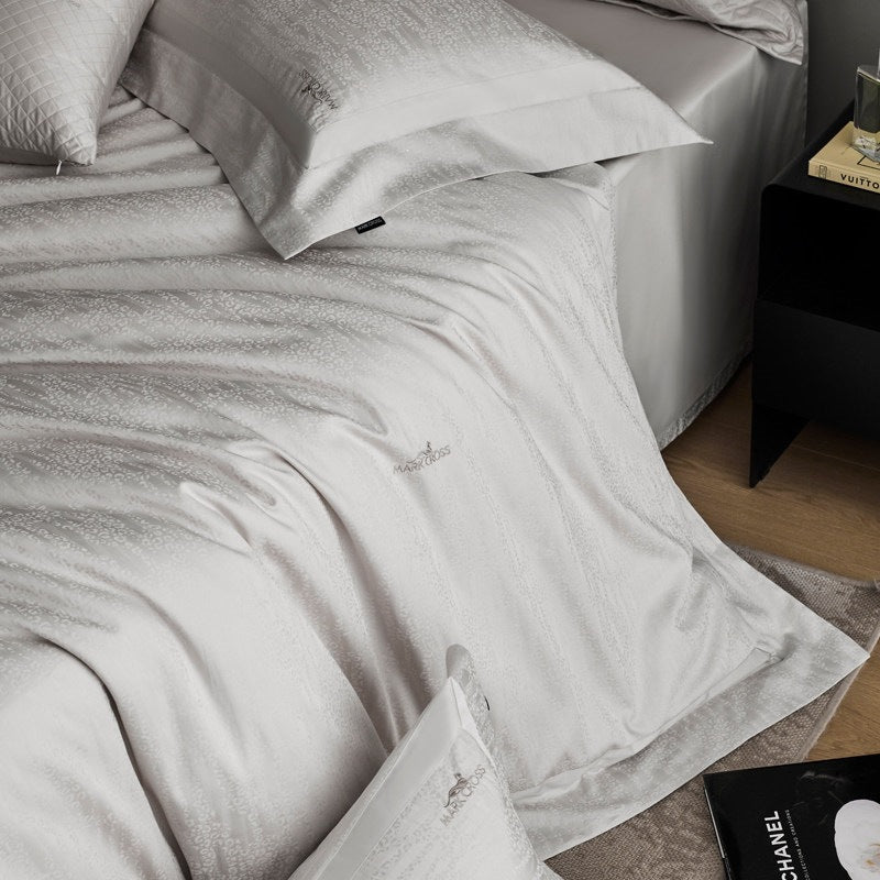 Premium cotton satin bedding set with subtle jacquard relief and fine hem