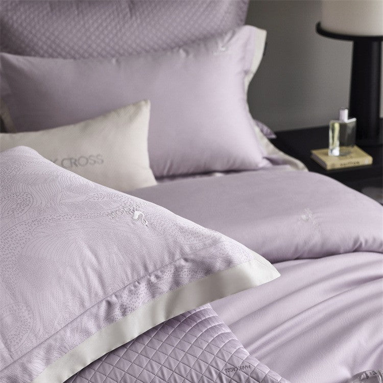Premium duvet cover set with subtle jacquard structure and decorative ribbon Kalsten