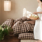 Checked cotton bedding set with decorative ribbons, ruffles, and subtly embroidered detail