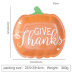 Disposable paper plates in pumpkin shape with spooky face design