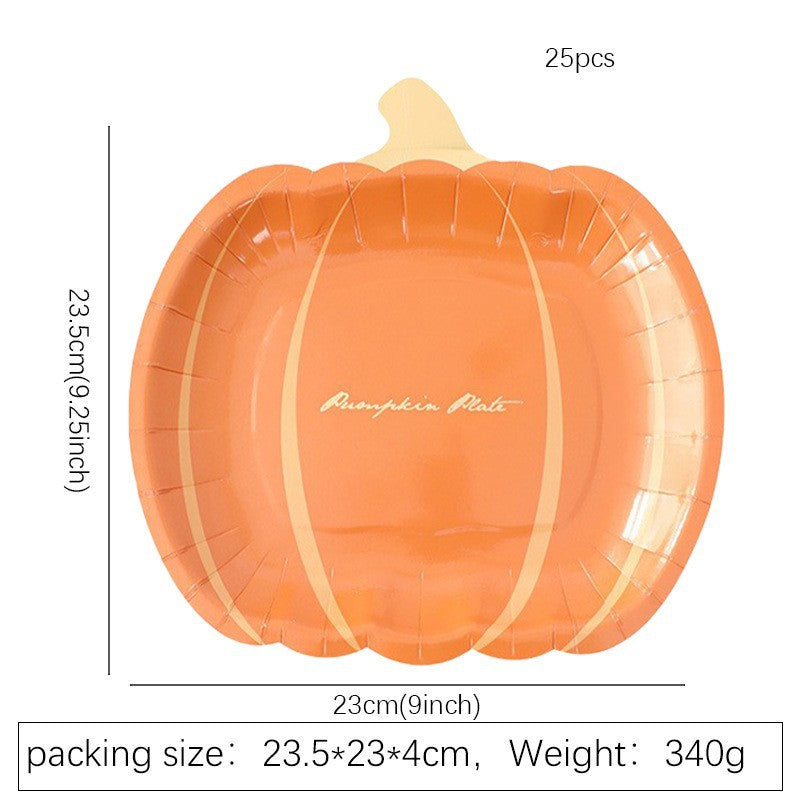 Disposable paper plates in pumpkin shape with spooky face design