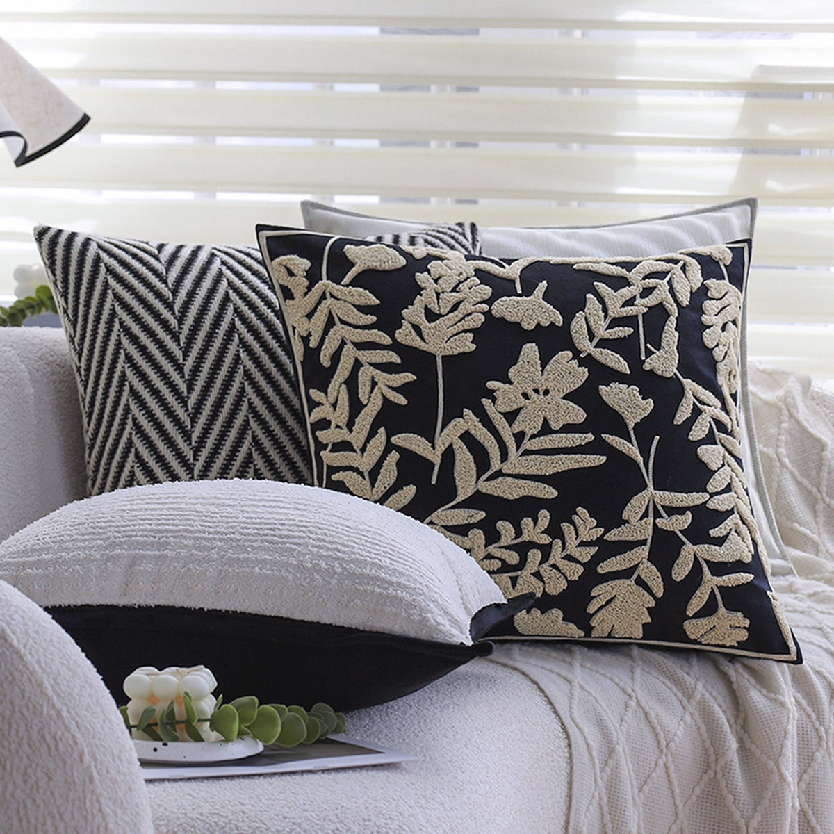Square cushion cover with subtle herringbone texture and surrounding piping seam Kalsten