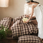 Checked cotton bedding set with decorative ribbons, ruffles, and subtly embroidered detail