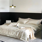 Exclusive satin bedding set with fine piping and monogram embroidery