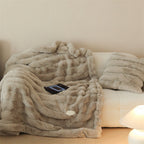 Faux fur blanket with ribbed structure design and velvety soft pile