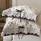 Satin bed linen set with romantic floral pattern and lace border Kalsten