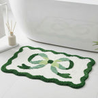 Bath mat with bow motif, synthetic fiber fabric