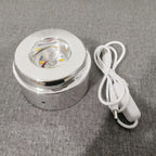 Glowing crystal ball with rotating base